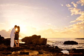 Koolina Family Pictures Engagement Young couple at Sunset at Secret Beach Oahu Hawaii