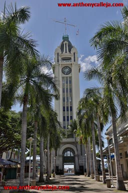 The Aloha Tower is a lighthouse that is considered one of the landmarks of the state of Hawaii in the United States. Opened on September 11, 1926 at a then astronomical cost of $160,000. The Aloha Tower is located at Pier 9 of Honolulu Harbor. It has & continues to be a guiding beacon welcoming vessels to the City & County of Honolulu. Just as the Statue of Liberty greeted hundreds of thousands of immigrants each year to New York City, the Aloha Tower greeted hundreds of thousands of immigrants to Honolulu. At 10 stories & 184 feet (56 m) of height topped with 40 feet (12 m) of flag mast, for four decades the Aloha Tower was the tallest structure in Hawaii.