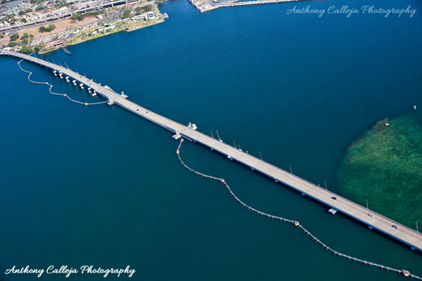 Aerial photo of USS Arizona Memorial Museum, USS Bowfin Submarine Museum, and the bridge to Ford Island