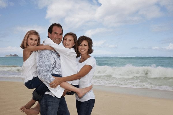 Clothing Ideas - Beach Portrait - family of four wearing white and denim clothes for a photo shoot at Bellows Beach, Oahu, Hawaii
