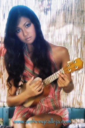 Fashion Model with ukulele, North Shore, Oahu, Hawaii