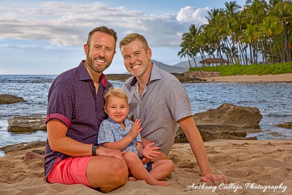 Oahu Hawaii Portrait Photography Packages & Services - Family of three sitting on the sands of Secret Beach, KoOlina Resort, Honolulu County