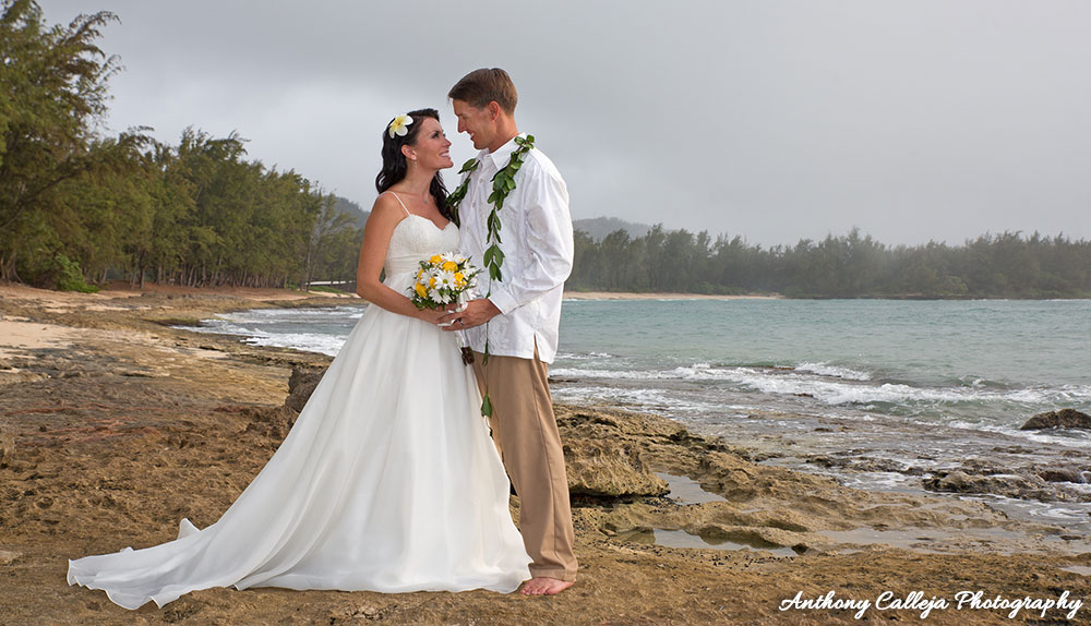 Oahu Wedding Photography - Portrait of Bride and Groom gazing in each other's eyes, Turtle Bay, North Shore