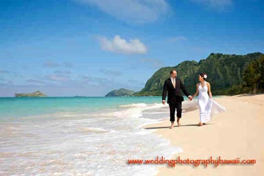 Hawaii Wedding Photographer - bride and groom holding hands walking on Waimanalo beach