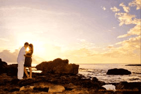 Photographer Near Marriott Koolina Beach Club Engagement Young couple at Sunset at Secret Beach Oahu Hawaii