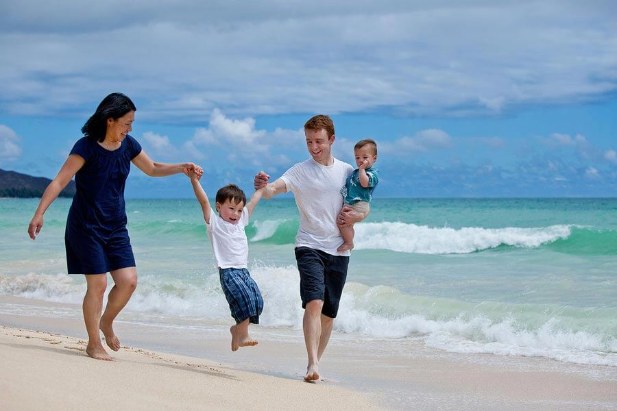 Affordable Photographer in Waianae - portrait of a family or four, holding hands, walking on the beach
