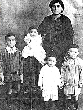 Caruana Family Portrait, circa 1922. From left to right: my uncle John (Ganni) Caruana, my mother Theresa Caruana, my grandmother Vittoria Caruana, my uncle Gregory (Gori) Caruana, and my uncle Carmenu Caruana.