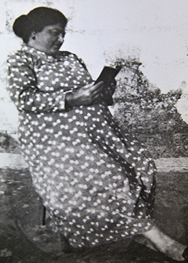 Photo of my maternal grandmother, Vittoria Mercieca, captured on her 18th birthday.She’s seen sitting down, reading the paper.